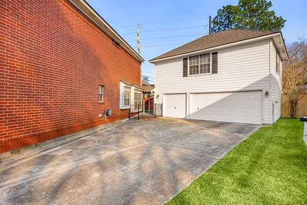 a view of a house with a yard and a porch
