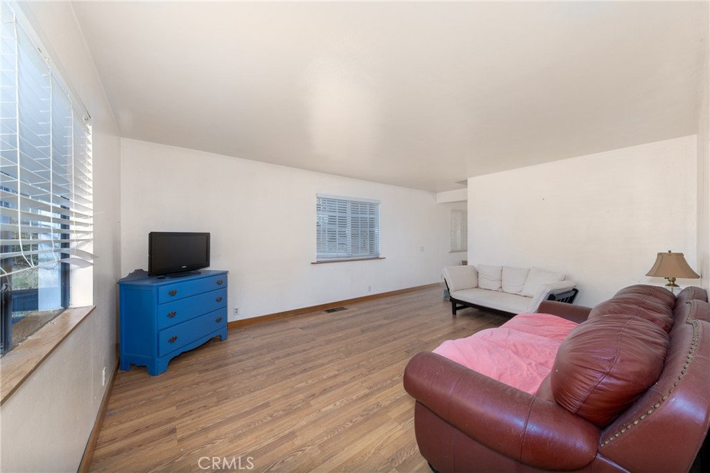 26785 Hopkins Road Idyllwild, CA 92549 - Photo 12 of 46 a living room with furniture and a flat screen tv
