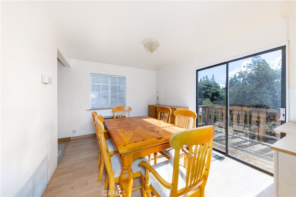 26785 Hopkins Road Idyllwild, CA 92549 - Photo 17 of 46 a view of a dining room with furniture window and outside view