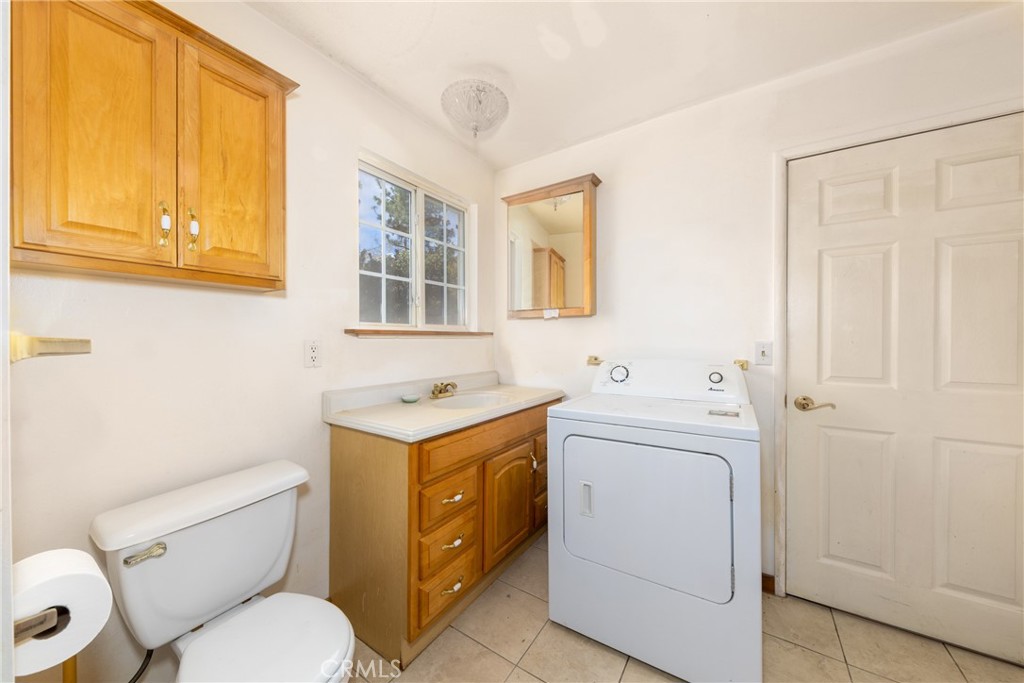 26785 Hopkins Road Idyllwild, CA 92549 - Photo 23 of 46 a bathroom with a sink toilet vanity and tub