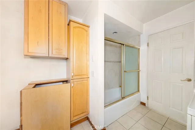 a bathroom with a sink mirror vanity and toilet