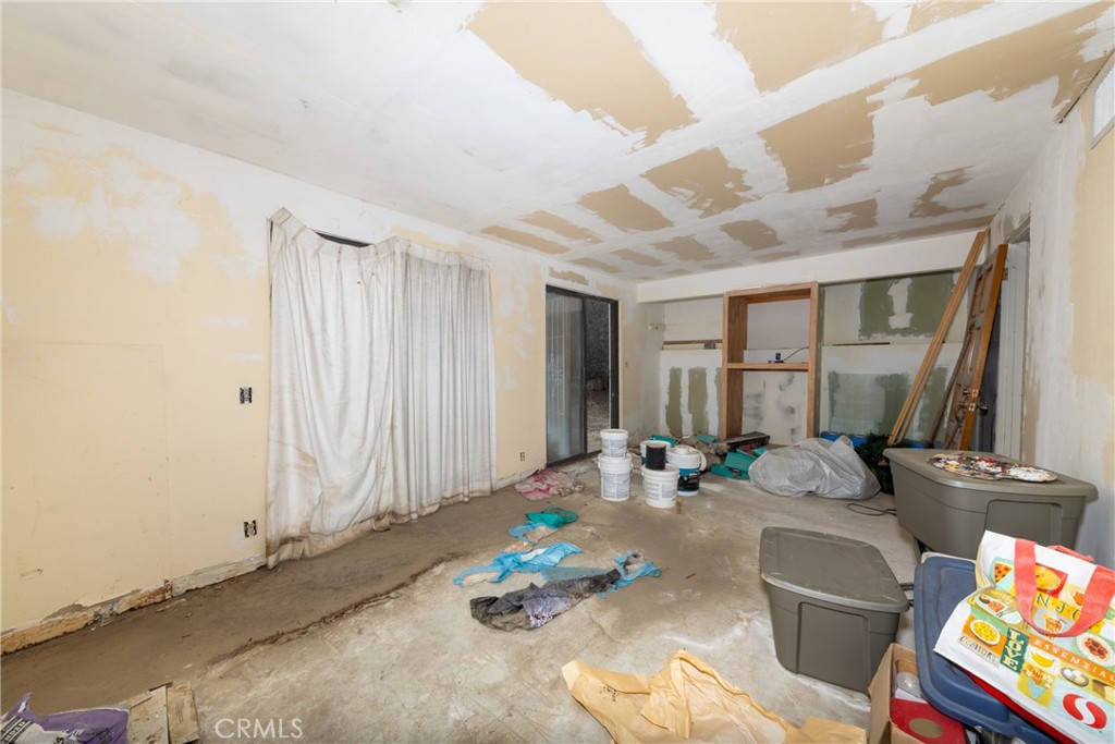 26785 Hopkins Road Idyllwild, CA 92549 - Photo 31 of 46 a living room with furniture and a window