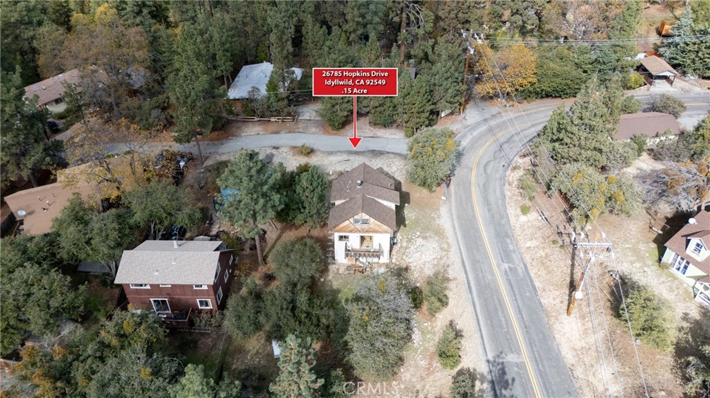 26785 Hopkins Road Idyllwild, CA 92549 - Photo 9 of 46 a sign that is sitting on a floor in front of a building