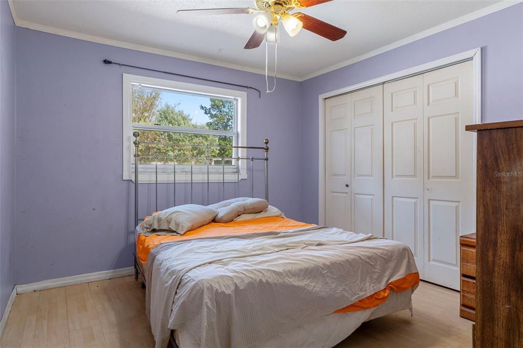 9267 Gibralter Street Spring Hill, FL 34608 - Photo 29 of 50 a bedroom with a bed and a window