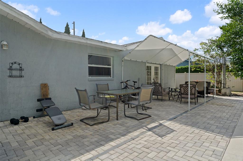9267 Gibralter Street Spring Hill, FL 34608 - Photo 42 of 50 a view of a patio with dining table and chairs