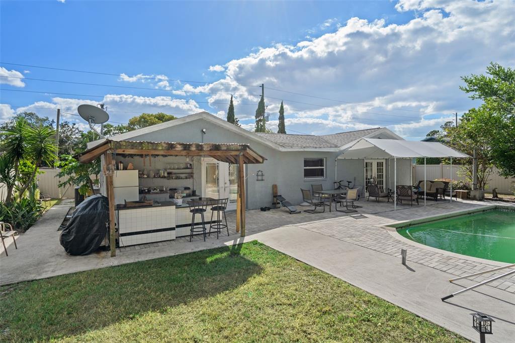 9267 Gibralter Street Spring Hill, FL 34608 - Photo 46 of 50 a front view of a house with garden and sitting area
