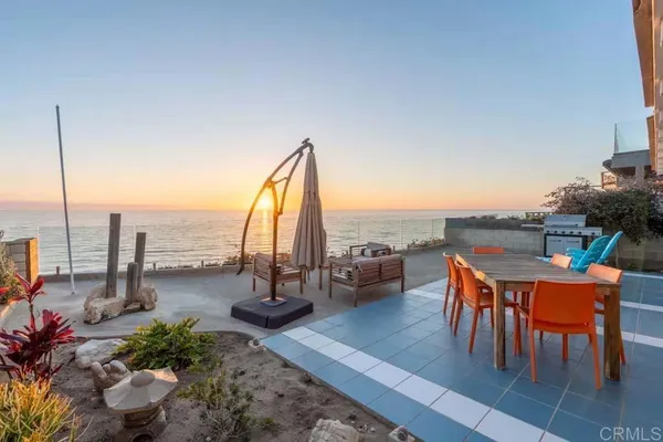a terrace with outdoor seating and city view