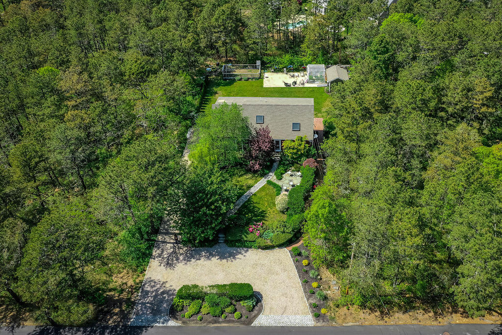 243 Red Brook Road Mashpee, MA 02649 - Photo 3 of 48 a view of a house with a yard and garden