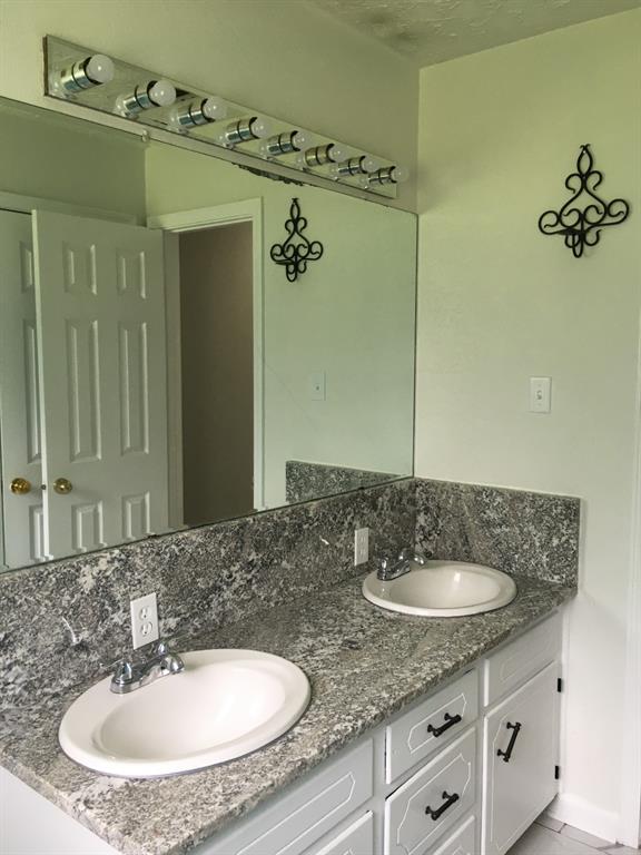 13403 Highway 157 Haughton, LA 71037 - Photo 10 of 40 a bathroom with a sink and a mirror