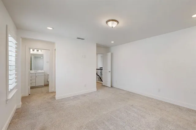 an empty room with a bathroom