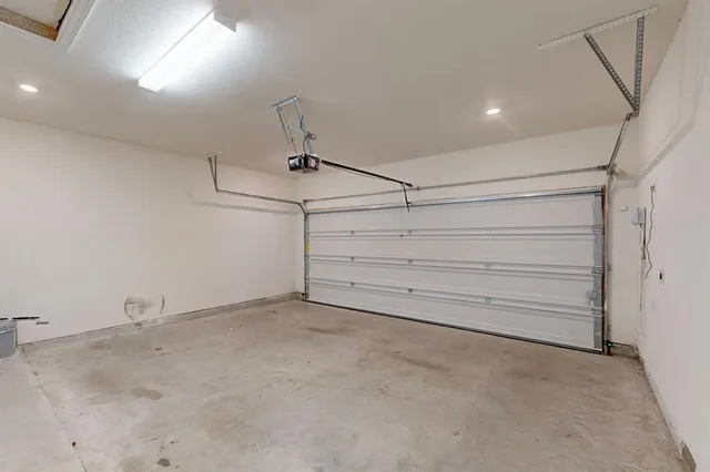 a view of a room with gym equipment and large window