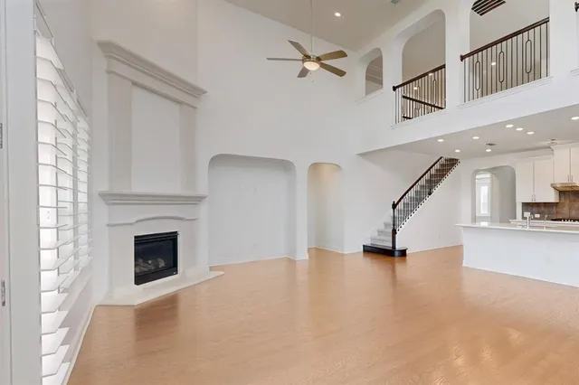 a view of entryway and hall with a fireplace