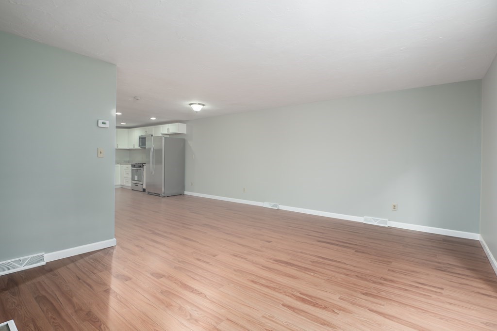 4 Shellback Way, Unit A4 Mashpee, MA 02649 - Photo 12 of 30 a view of empty room with wooden floor
