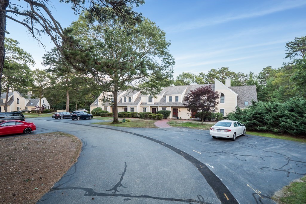 4 Shellback Way, Unit A4 Mashpee, MA 02649 - Photo 27 of 30 a cars parked on the side of the street