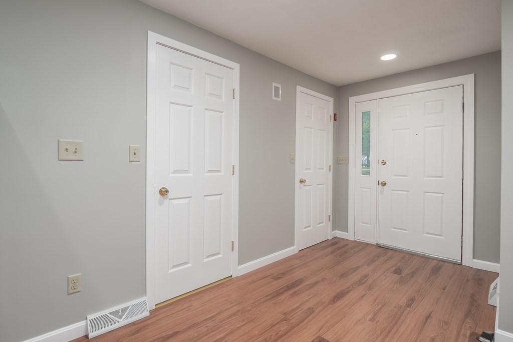 4 Shellback Way, Unit A4 Mashpee, MA 02649 - Photo 4 of 30 a view of empty room with wooden floor