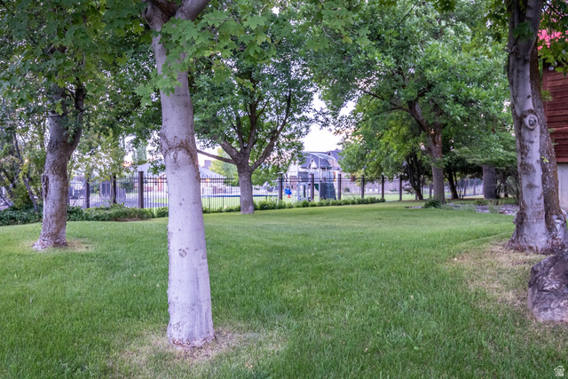 435 Canyon Road Millville, UT 84326 - Photo 58 of 113 Expansive green lawn framed by mature trees