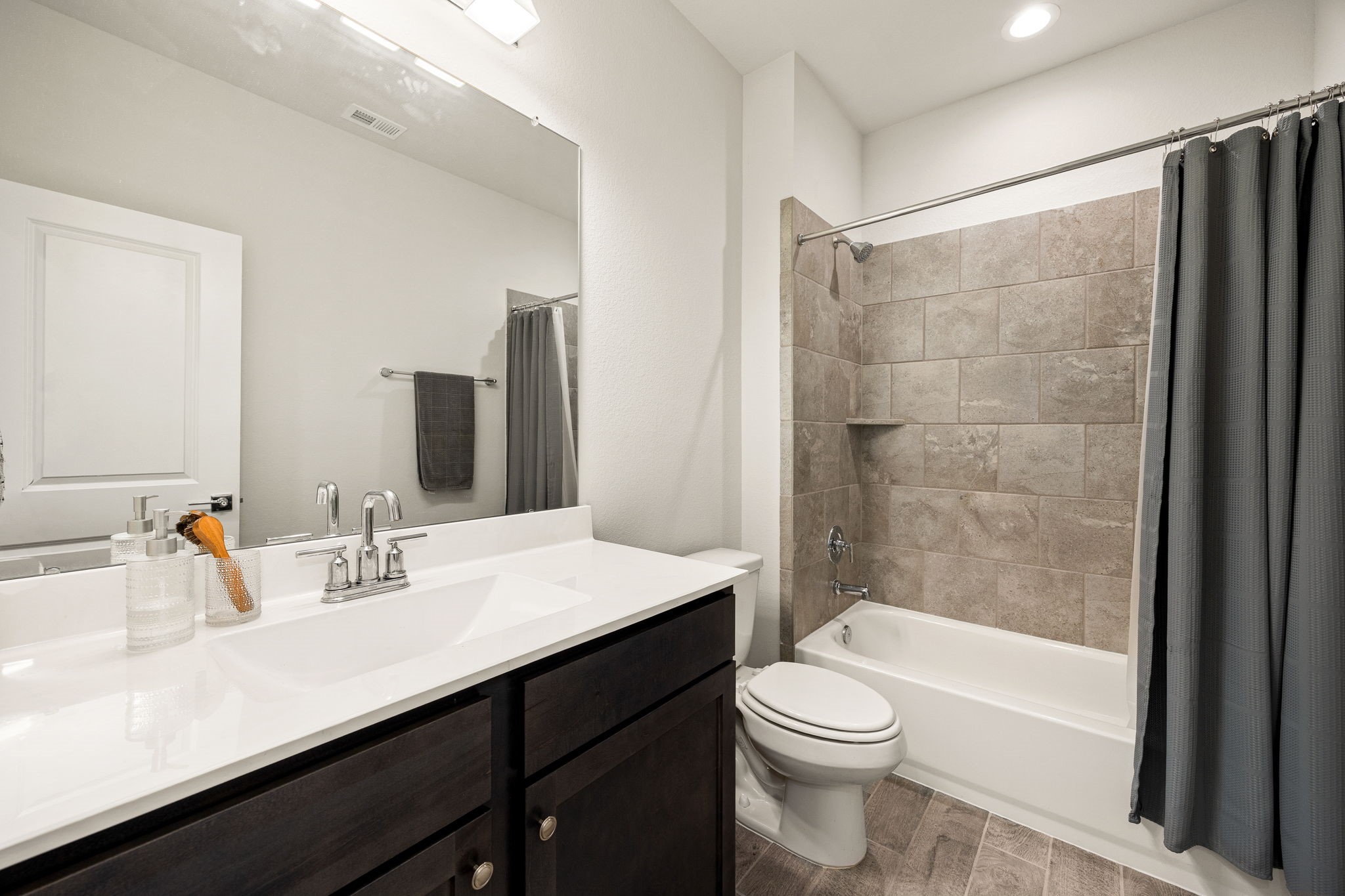 33142 School Hl Road Fulshear, TX 77441 - Photo 22 of 29 a bathroom with a sink a toilet and shower