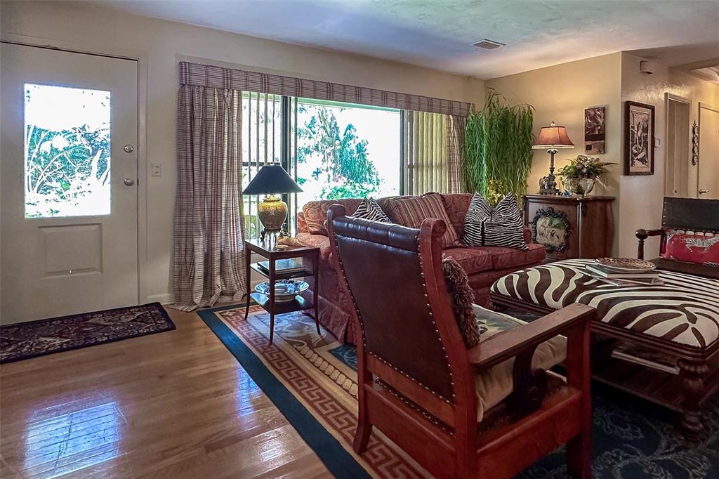 3751 Southeast 3rd Avenue Ocala, FL 34480 - Photo 23 of 100 a living room with furniture and a floor to ceiling window