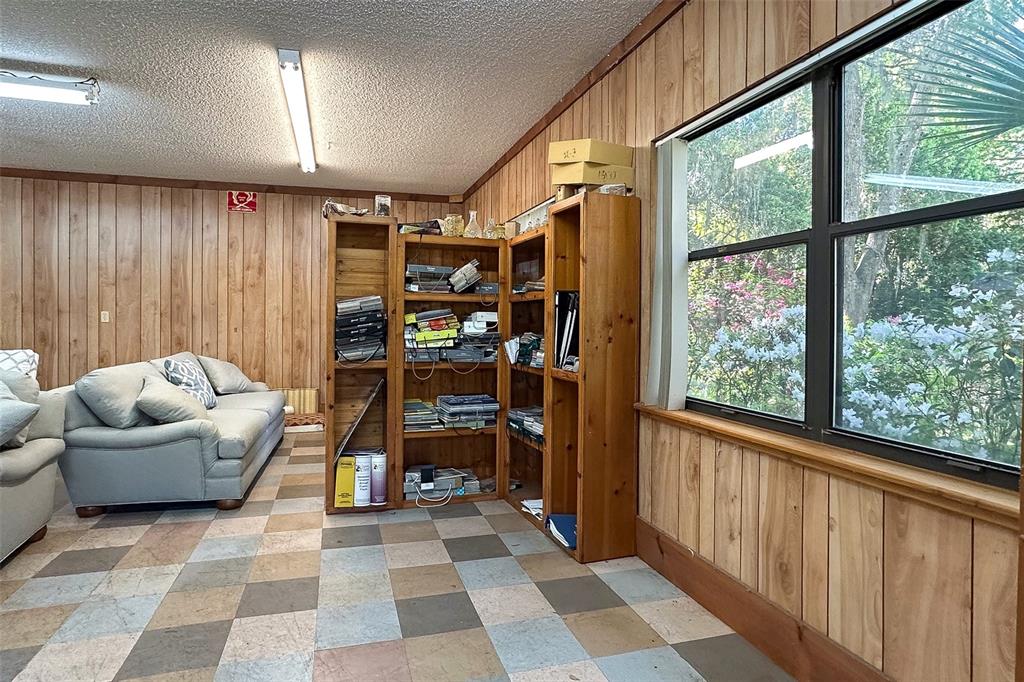 3751 Southeast 3rd Avenue Ocala, FL 34480 - Photo 90 of 100 a living room with furniture and a floor to ceiling window