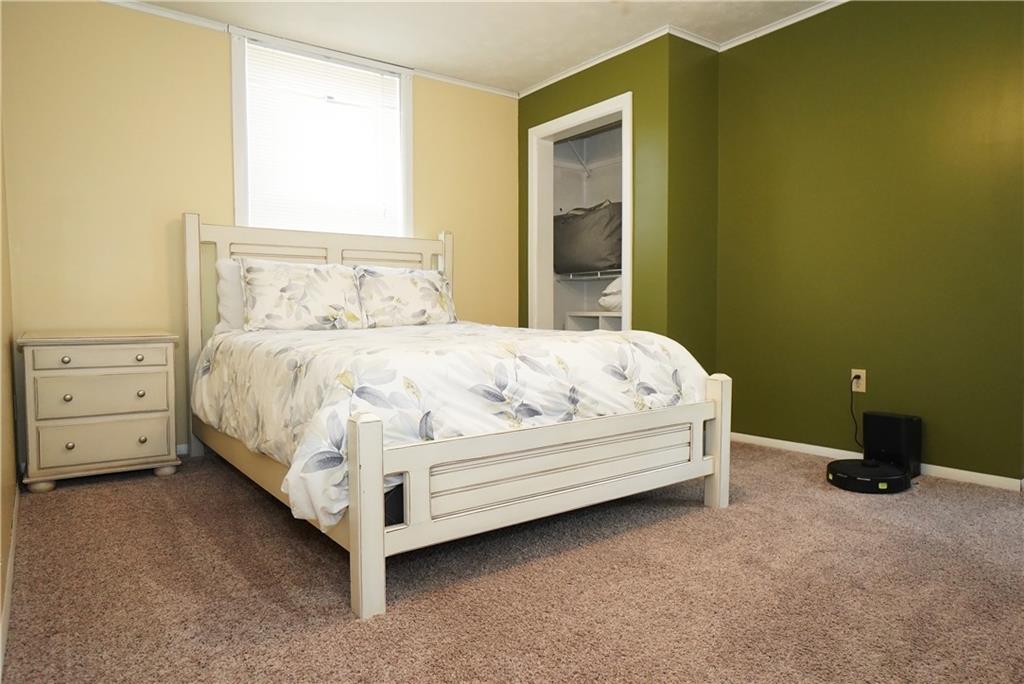 124 Hazel Street Kittanning, PA 16201 - Photo 19 of 26 a large bed sitting in a bedroom next to a window