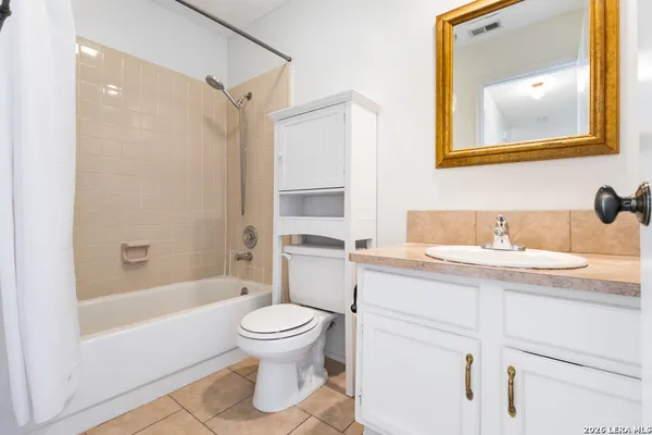 a picture of a bathroom with a door