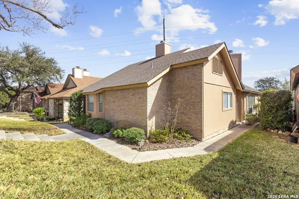 a view of a house with a yard