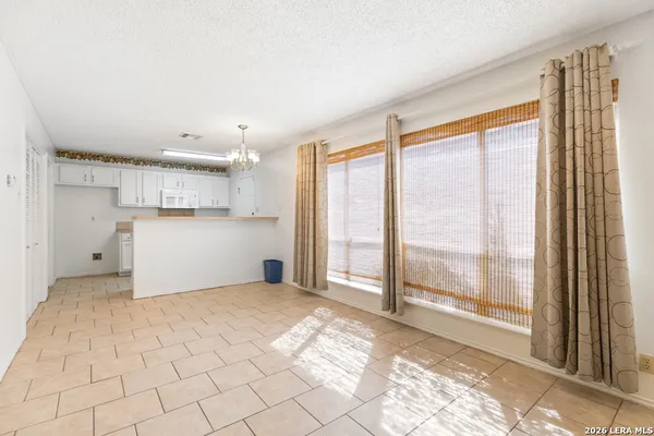 a view of a kitchen with a sink and a window
