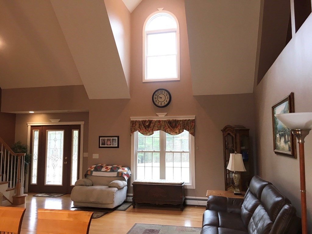 320 Putnam Hill Road Sutton, MA 01590 - Photo 11 of 40 a living room with furniture and a window