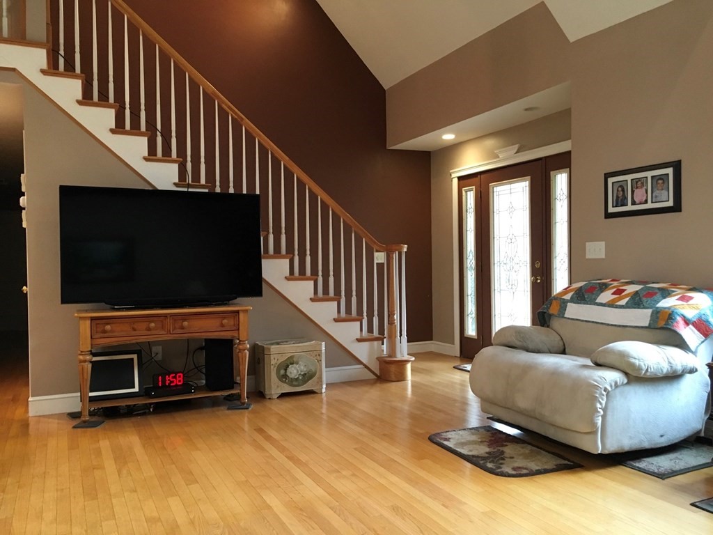 320 Putnam Hill Road Sutton, MA 01590 - Photo 15 of 40 a living room with furniture and a flat screen tv