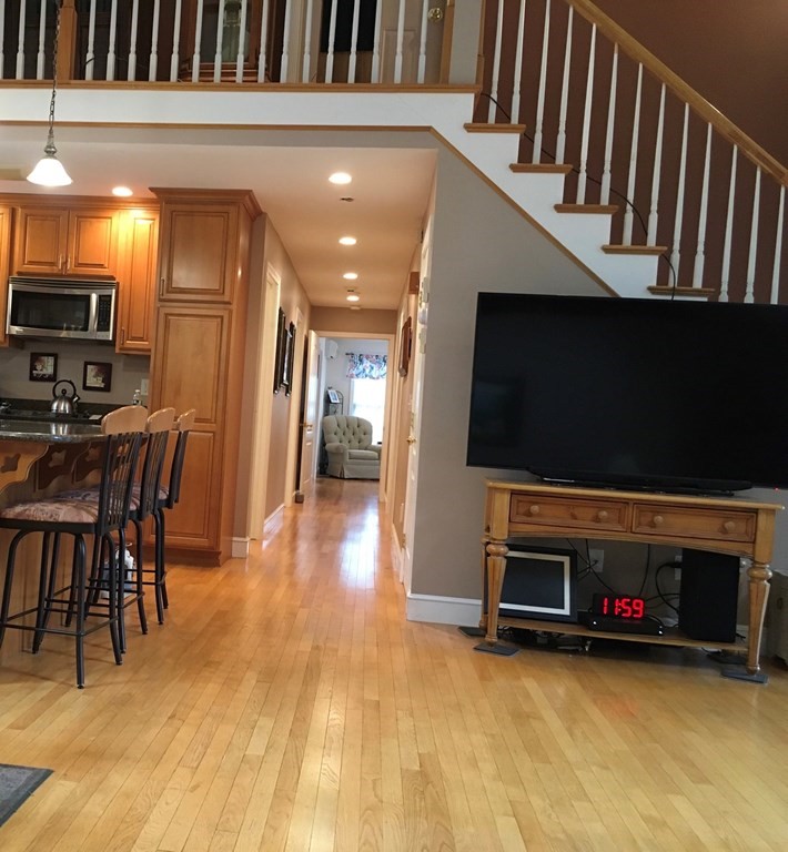 320 Putnam Hill Road Sutton, MA 01590 - Photo 18 of 40 a view of a livingroom with furniture and a flat screen tv
