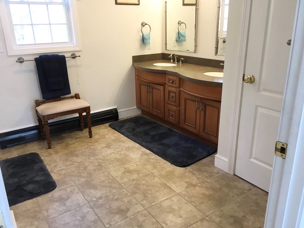 320 Putnam Hill Road Sutton, MA 01590 - Photo 20 of 40 a bathroom with a sink vanity and mirror