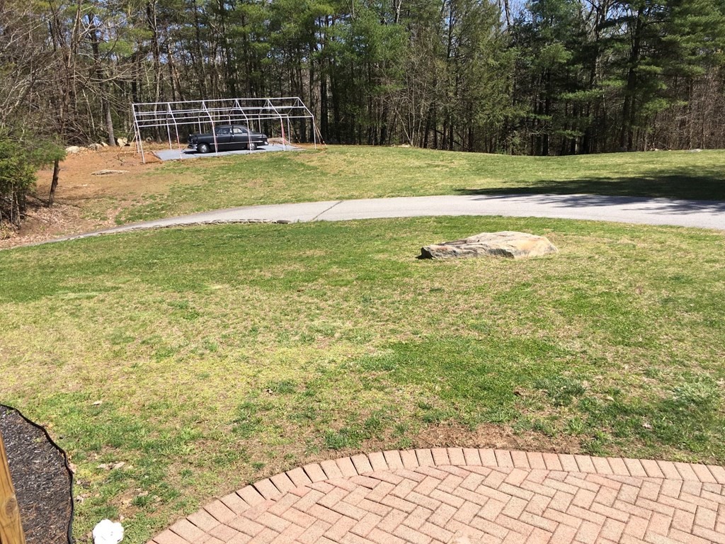 320 Putnam Hill Road Sutton, MA 01590 - Photo 28 of 40 a view of a swimming pool with a yard