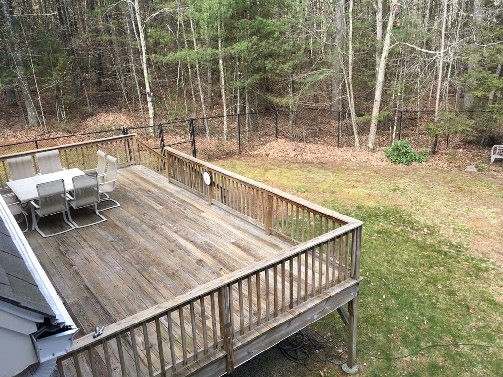 320 Putnam Hill Road Sutton, MA 01590 - Photo 33 of 40 a view of balcony with a large window and wooden floor