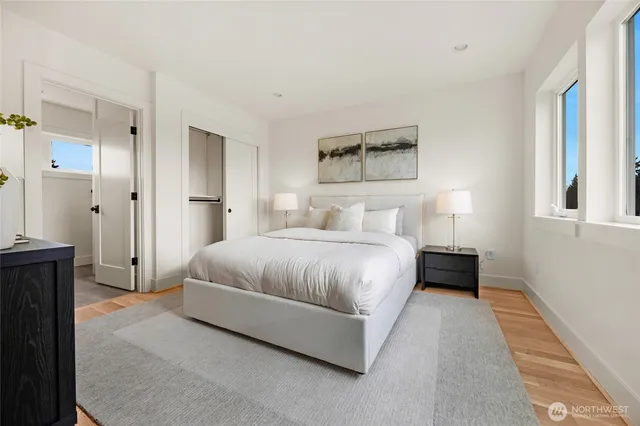 a bedroom with a bed and a night stand