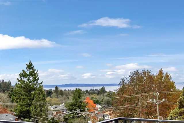 a view of swimming pool with sitting area