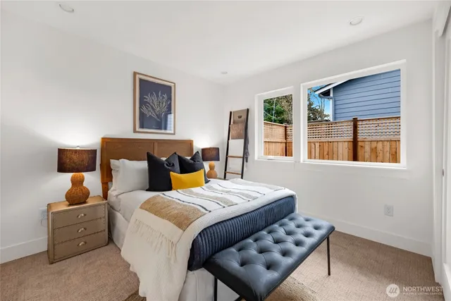 a bedroom with bed and a window