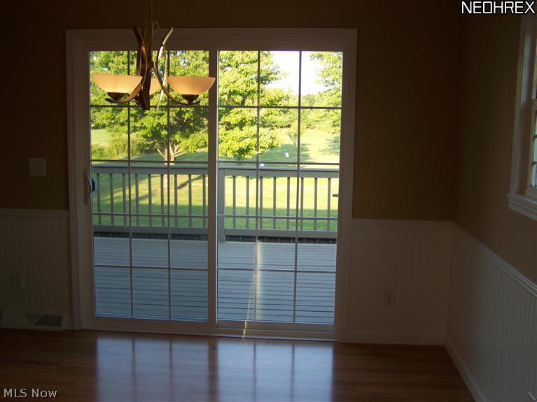 3800 Center Road Ashtabula, OH 44004 - Photo 11 of 25 Dining area with wainscoting and a new slider that leads to the deck.