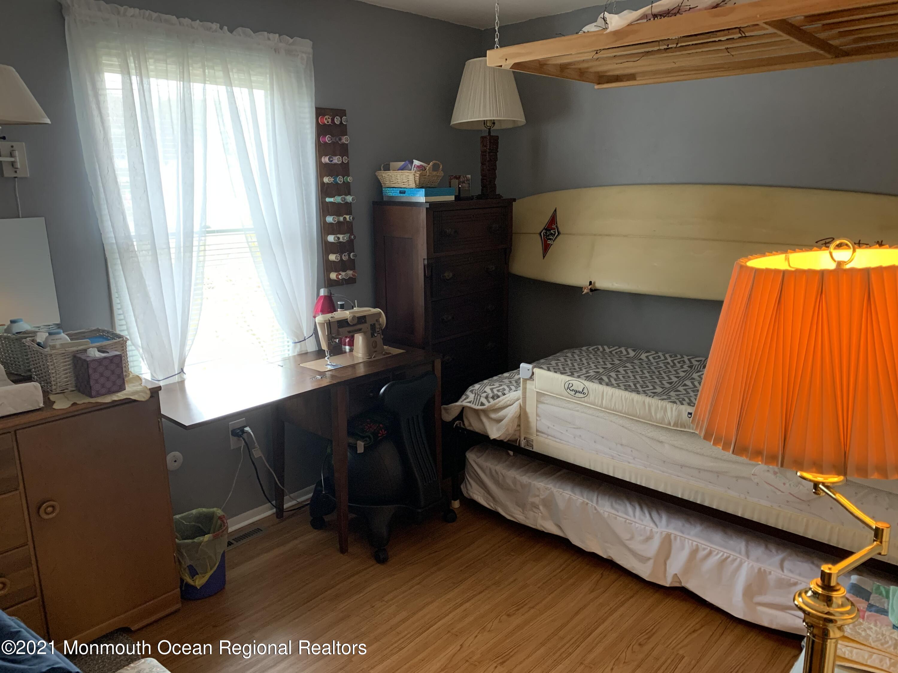 105 Seaspray Road Manahawkin, NJ 08050 - Photo 17 of 25 a bedroom with a bed and a window