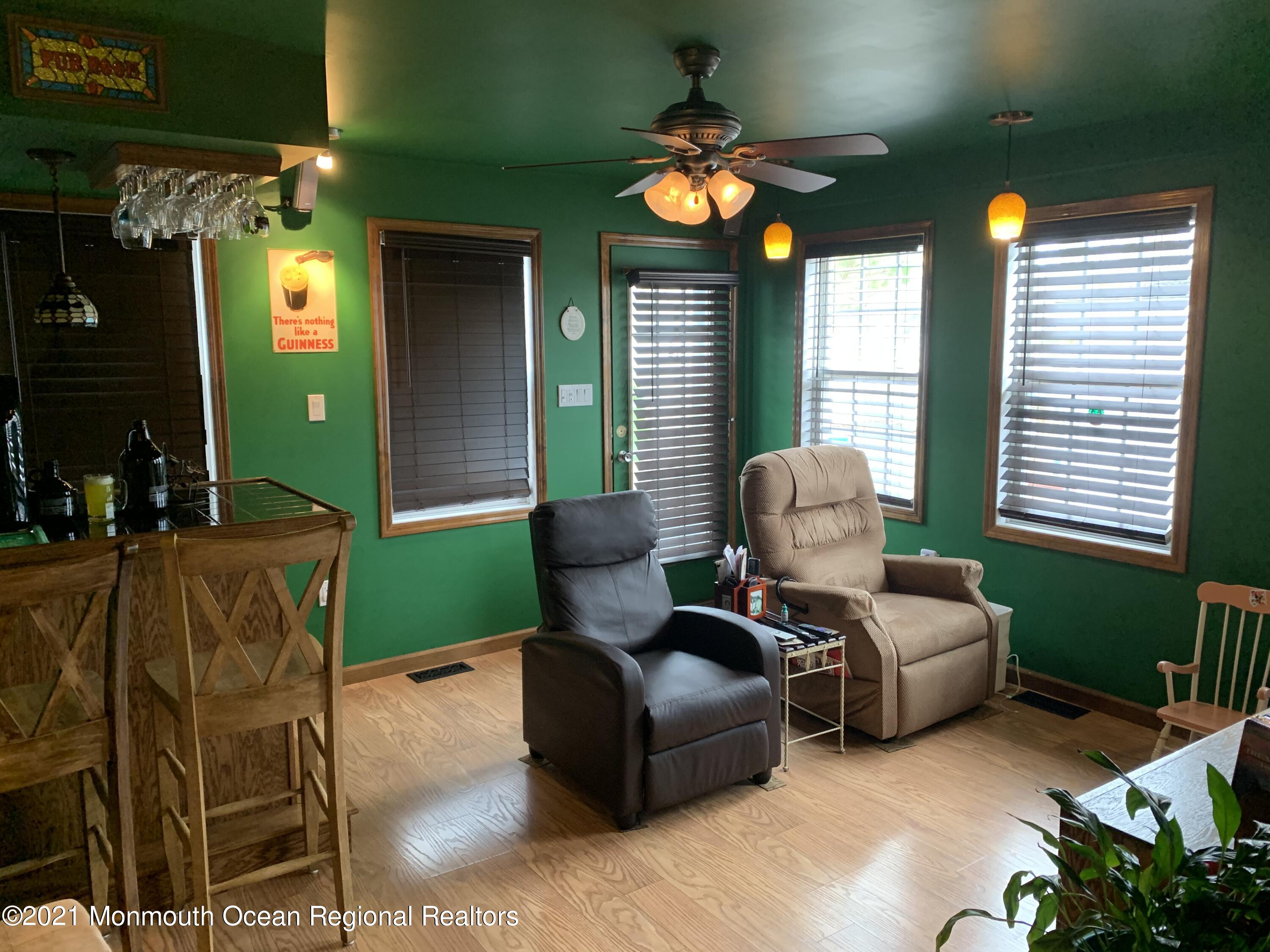 105 Seaspray Road Manahawkin, NJ 08050 - Photo 19 of 25 a living room with furniture and a large window