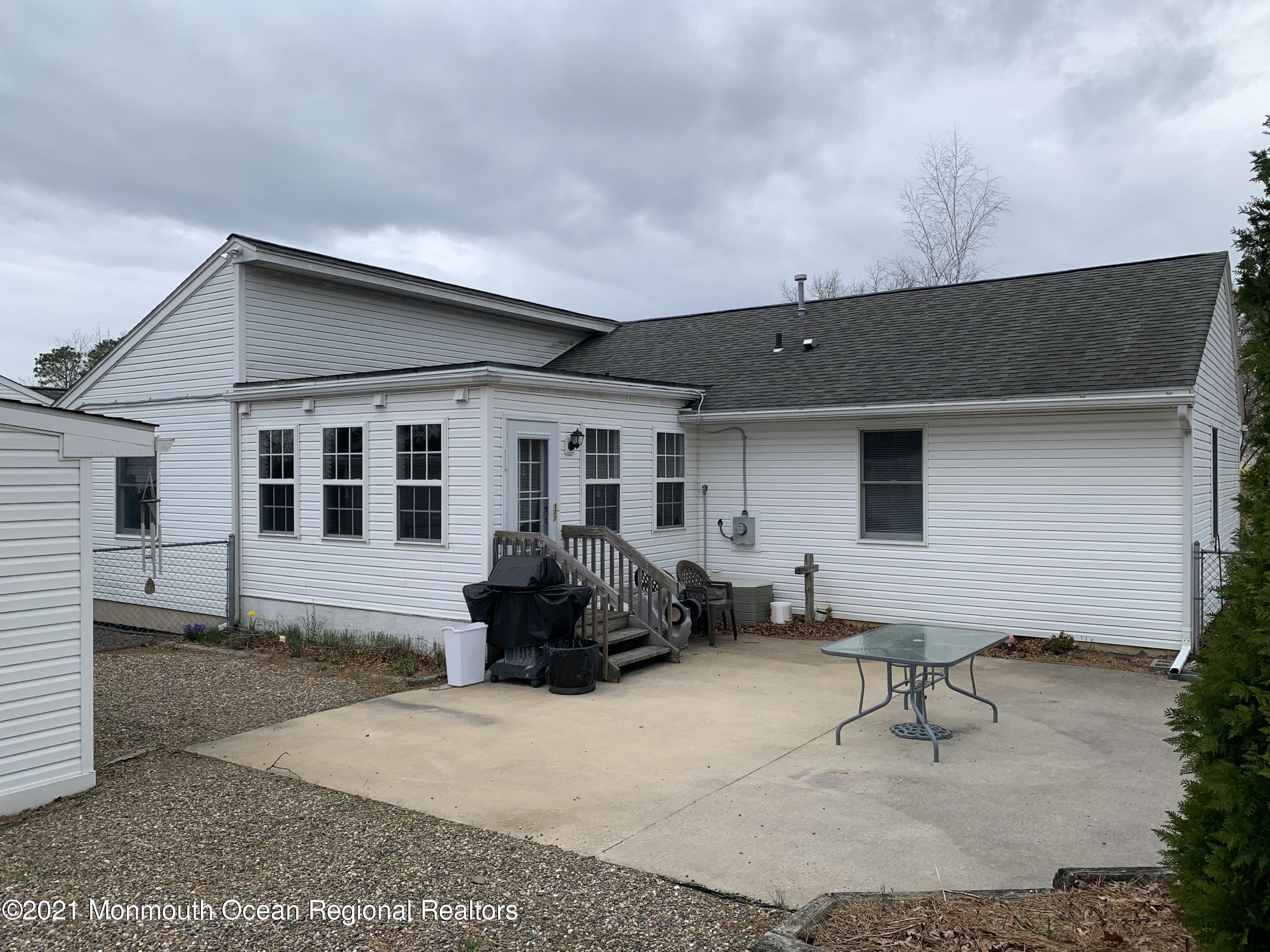 105 Seaspray Road Manahawkin, NJ 08050 - Photo 6 of 25 a house view with a sitting space