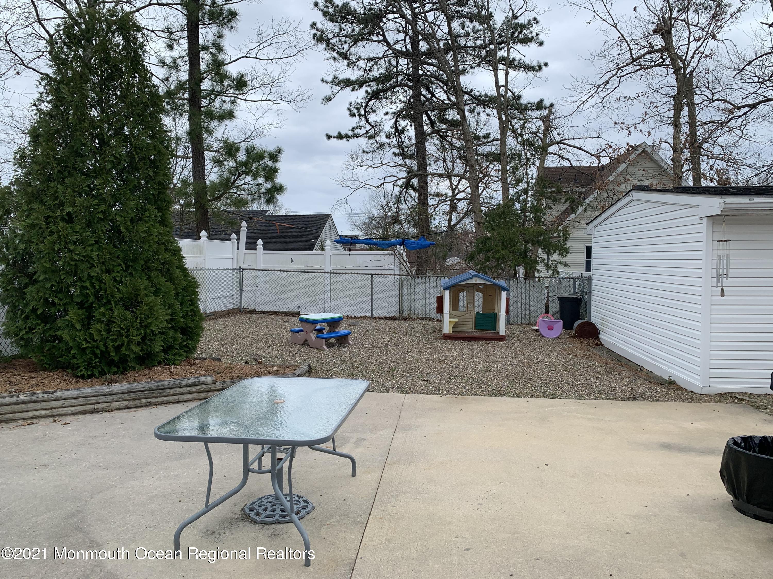 105 Seaspray Road Manahawkin, NJ 08050 - Photo 10 of 25 a front view of a house with garden