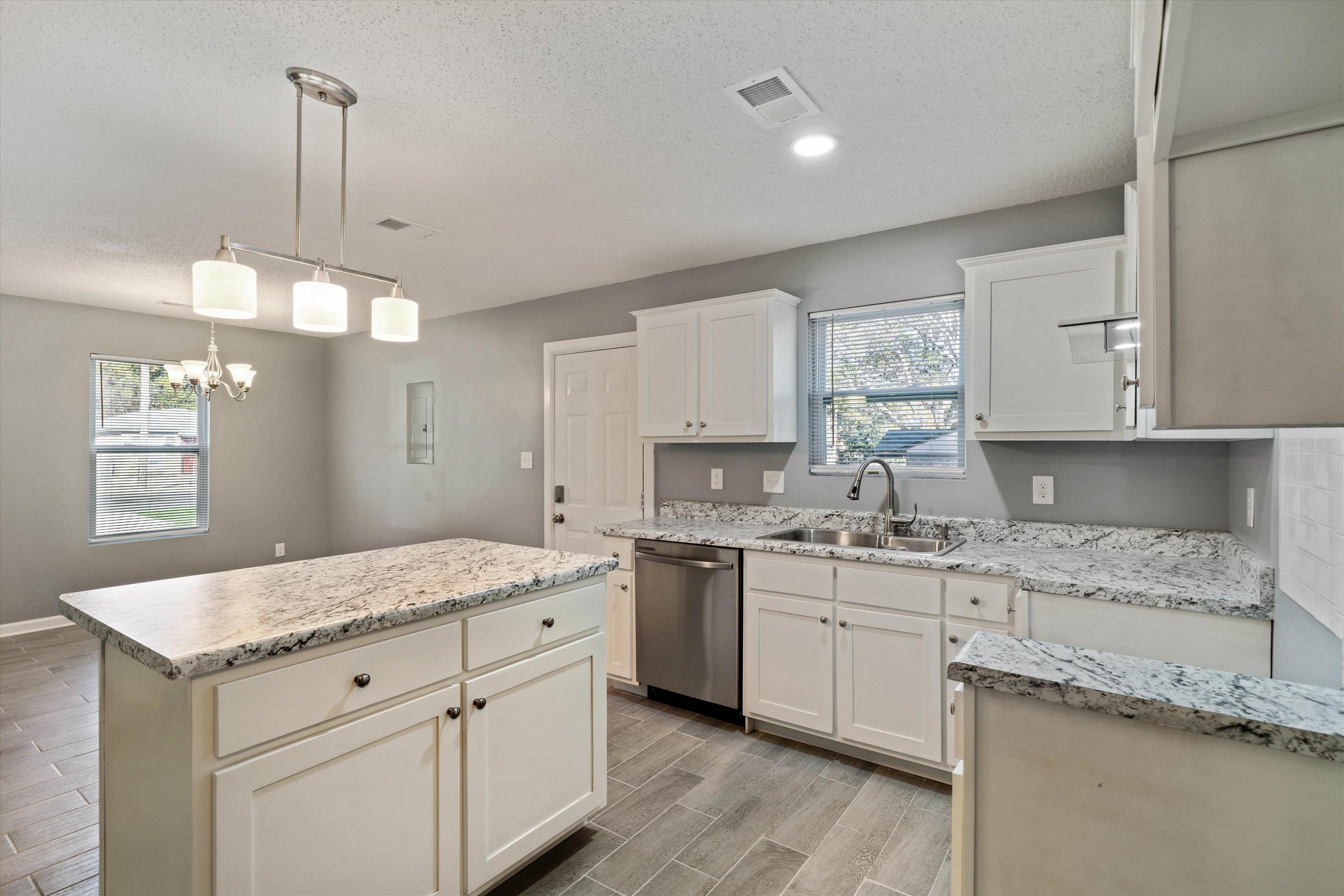 487 Delta Road Memphis, TN 38109 - Photo 11 of 25 a kitchen with a sink stove and cabinets
