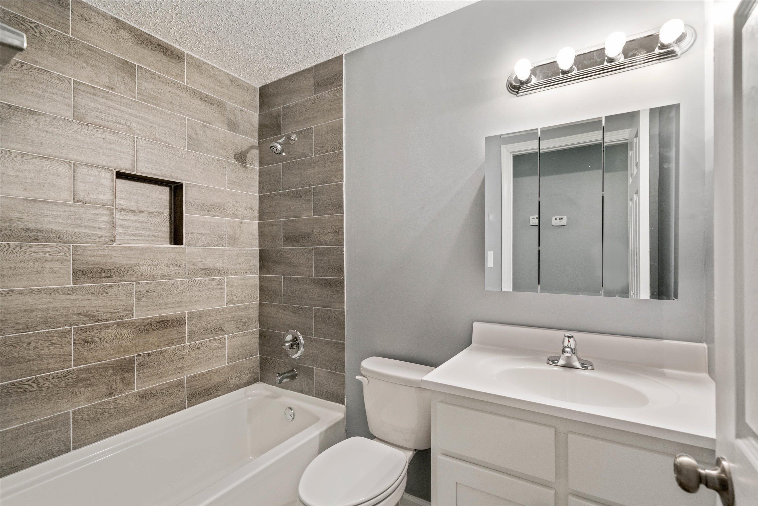 487 Delta Road Memphis, TN 38109 - Photo 16 of 25 a bathroom with a sink and a mirror
