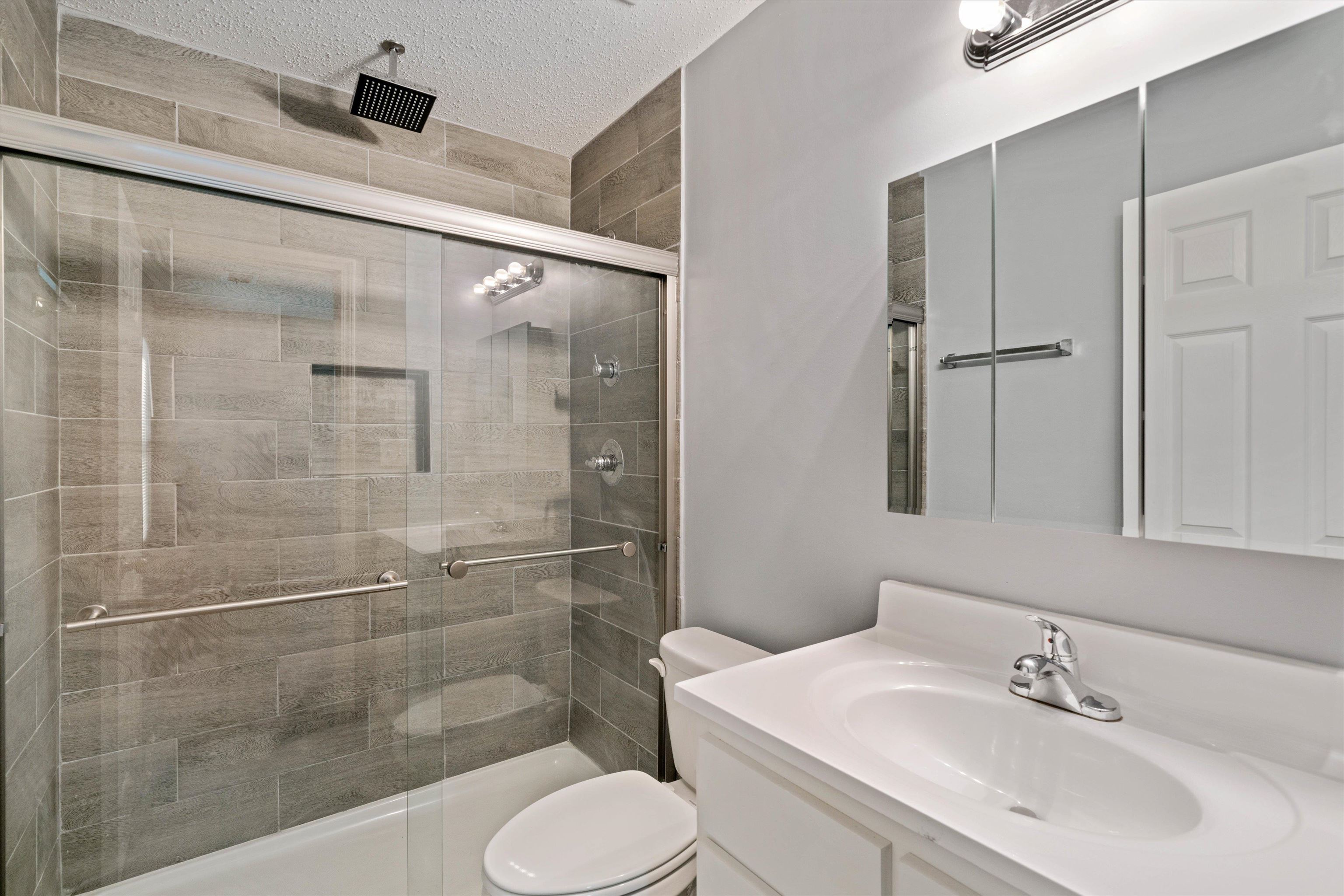 487 Delta Road Memphis, TN 38109 - Photo 19 of 25 a bathroom with a sink toilet and shower