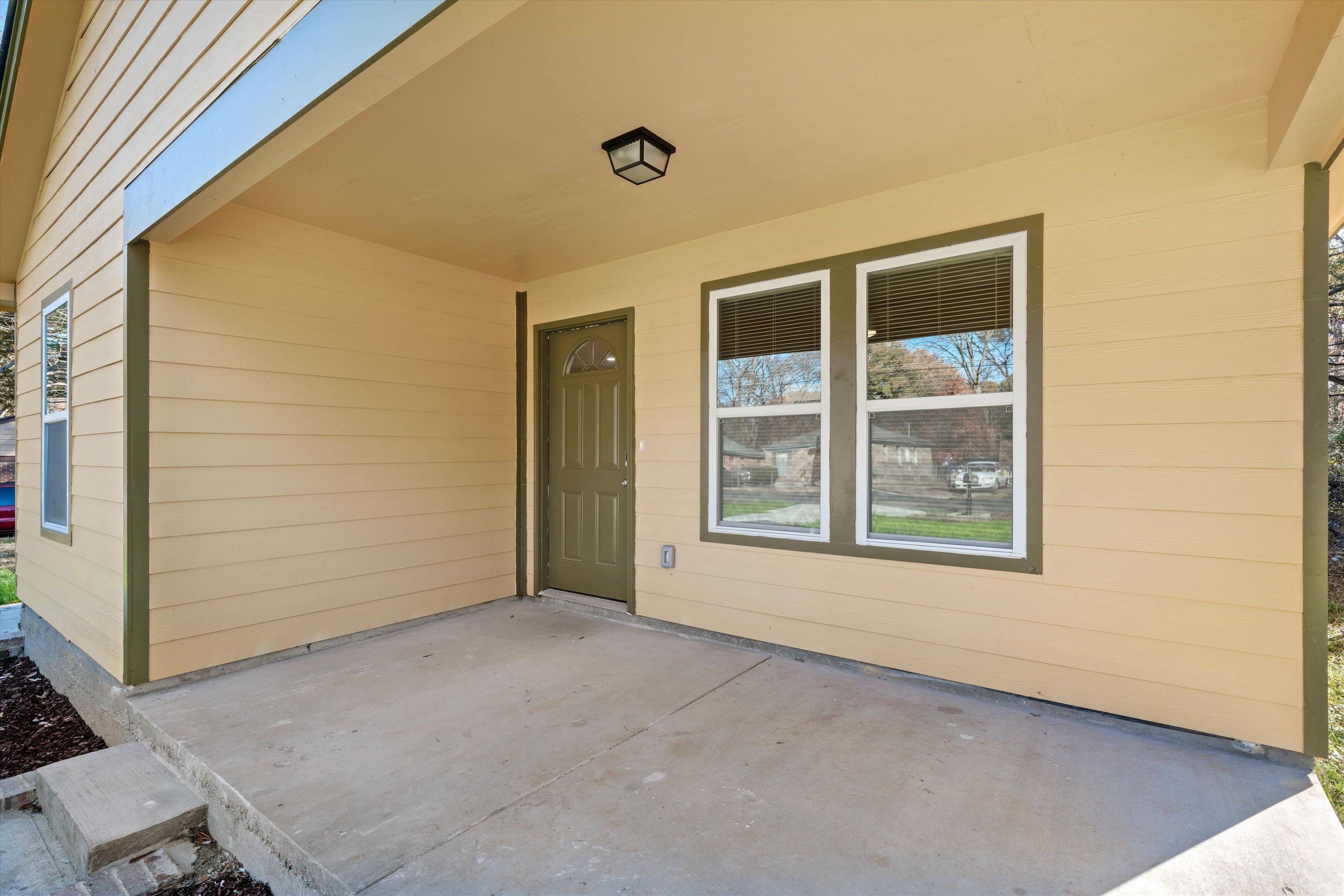 487 Delta Road Memphis, TN 38109 - Photo 2 of 25 a view of an empty room with a window