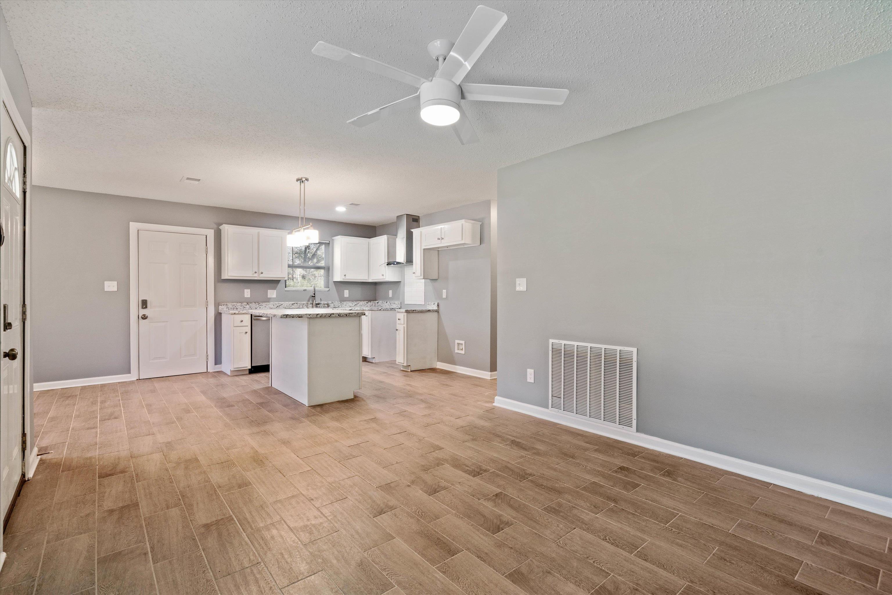 487 Delta Road Memphis, TN 38109 - Photo 5 of 25 a view of kitchen with wooden floor and window