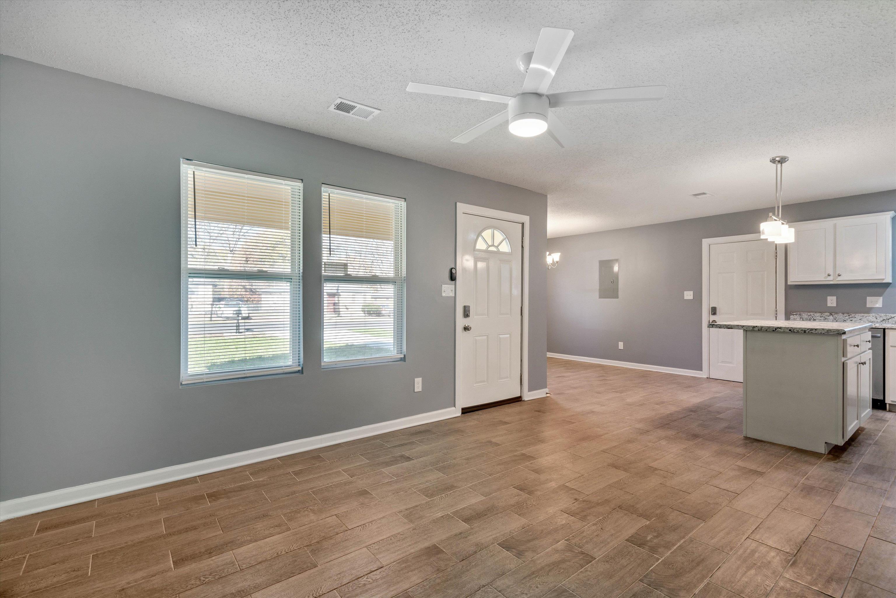487 Delta Road Memphis, TN 38109 - Photo 6 of 25 a view of an empty room with window and cabinet