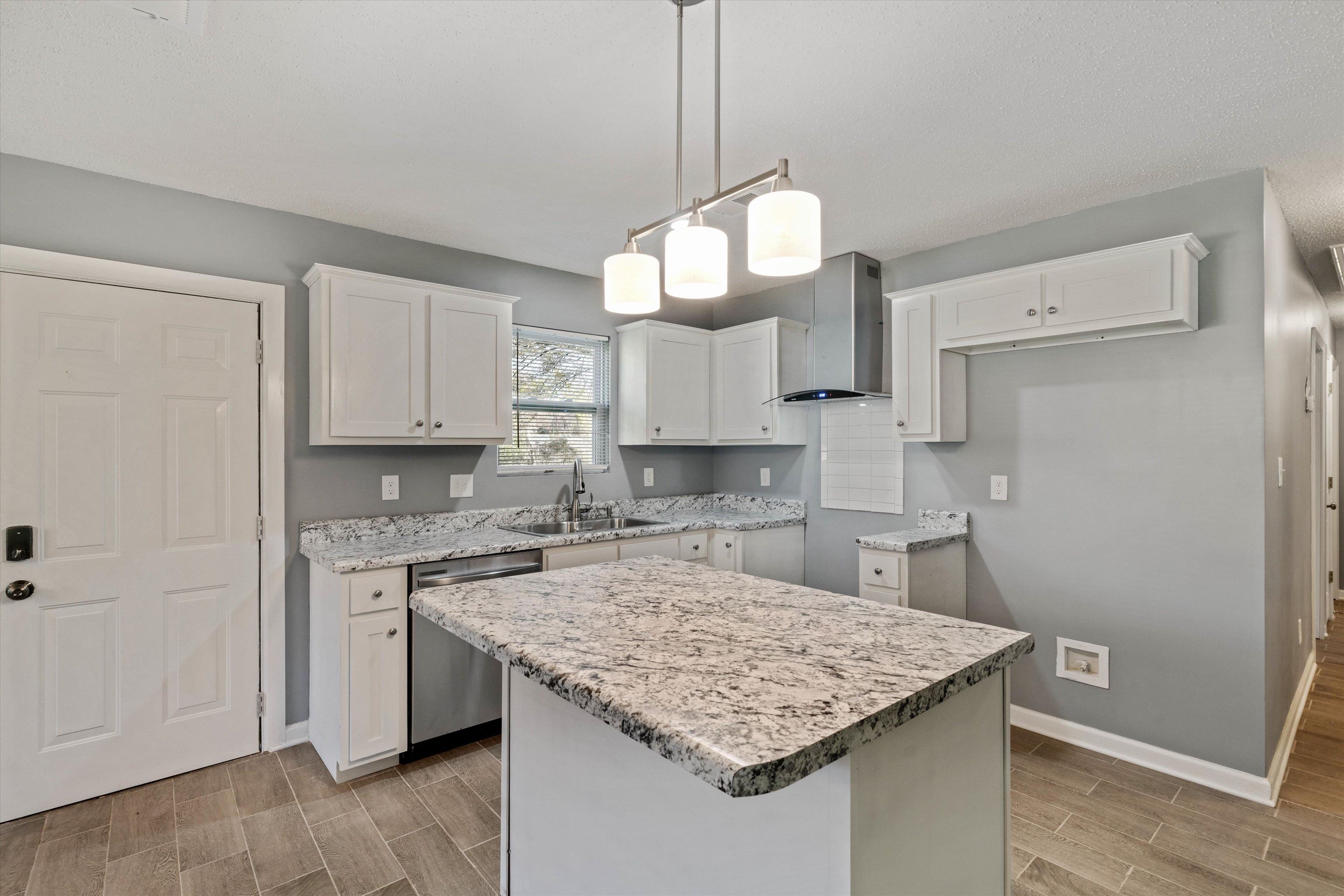 487 Delta Road Memphis, TN 38109 - Photo 10 of 25 a kitchen with cabinets appliances and a counter space