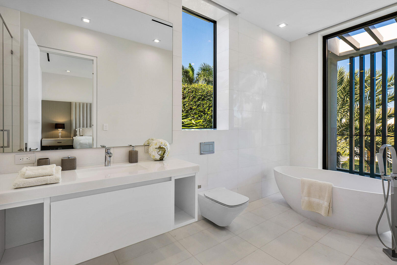 224 West Key Palm Road Boca Raton, FL 33432 - Photo 70 of 101 a bathroom with a toilet sink and mirror