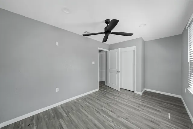 a view of room with wooden floor and window